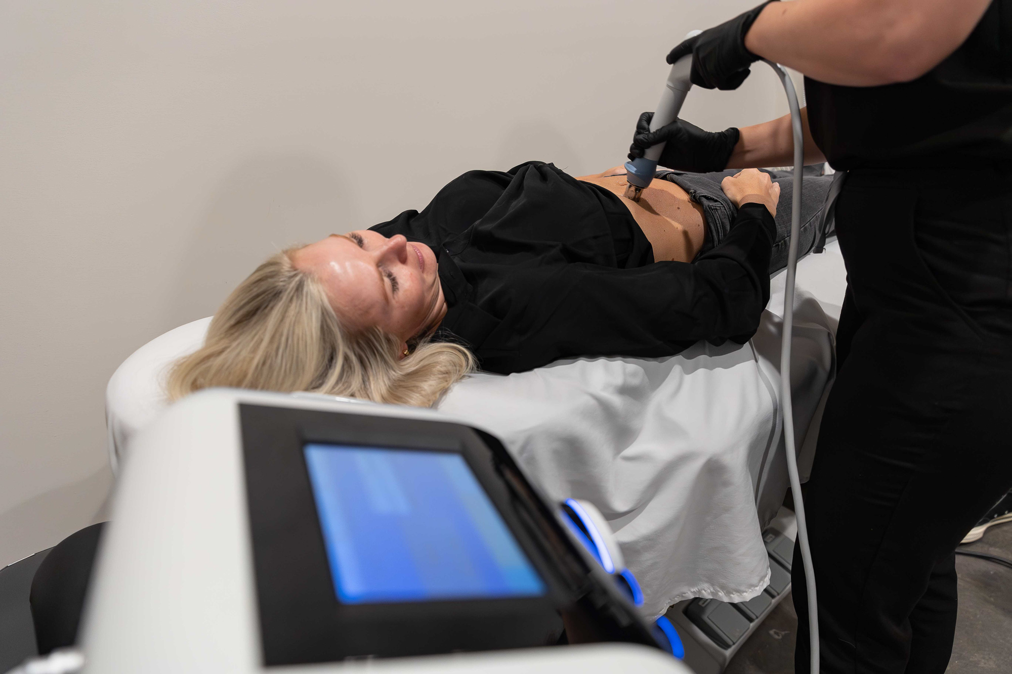 woman receives custom combination treatments from a med spa in homewood for body contouring