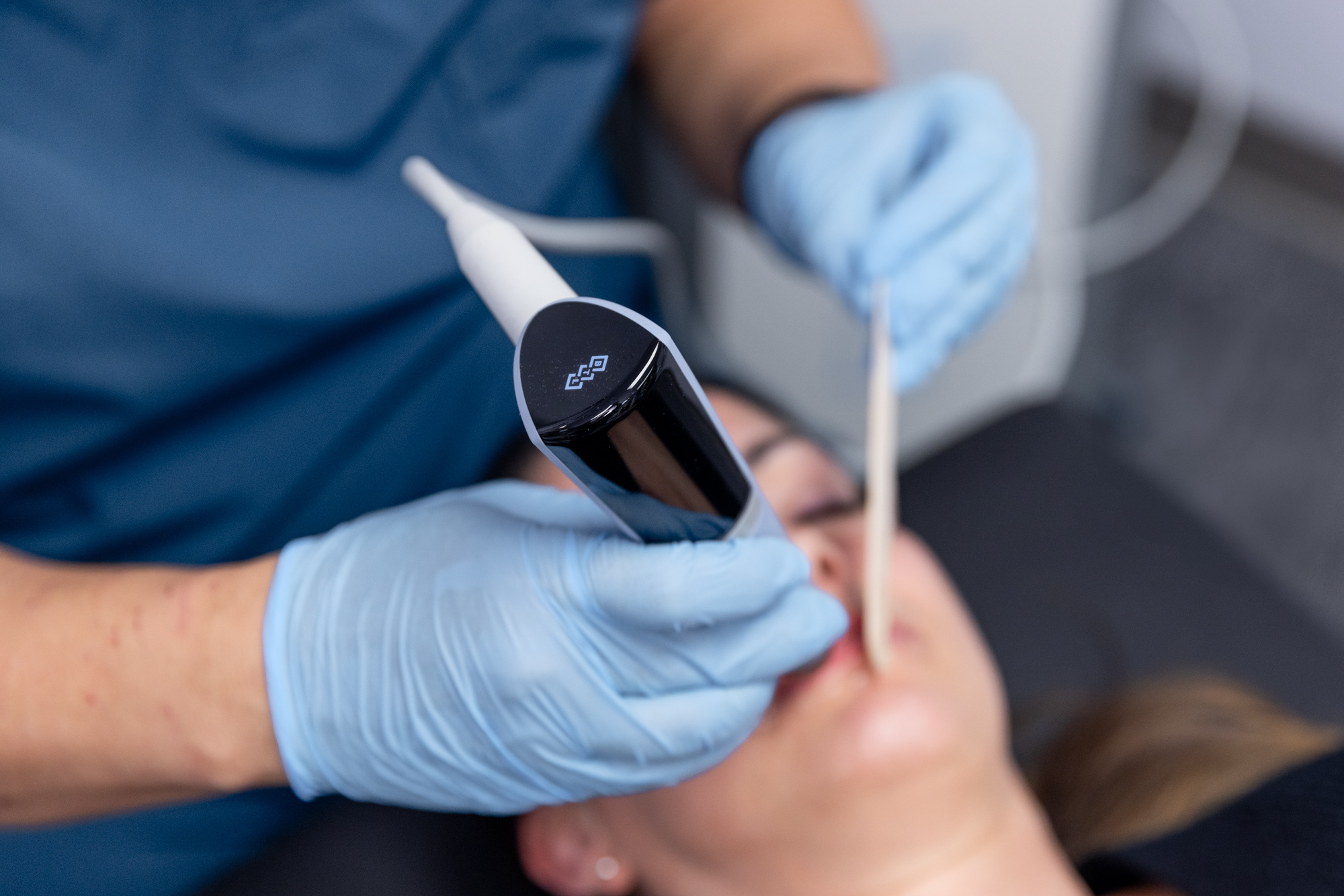 Close up of a woman undergoing facial sculpting using Exion 