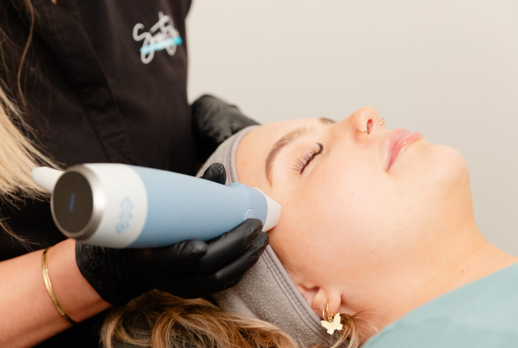 Close up of a woman receiving an Exion face treatment at an aesthetics center in Homewood.